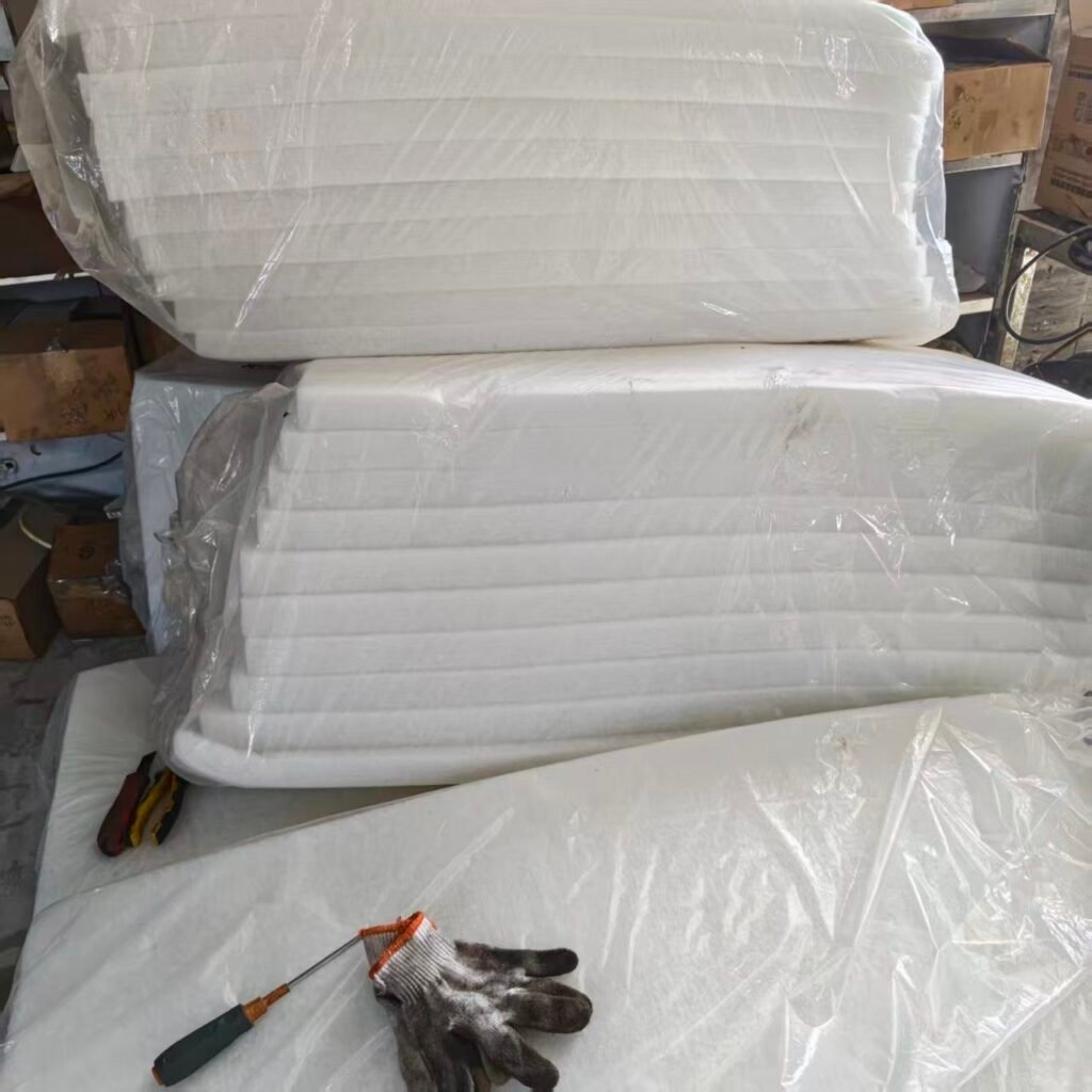 Packs of 1200 × 600 × 50 mm polyester acoustic wool on site